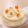 Classic White Forest Cake with vanilla layers, cherry filling, and white chocolate frosting.
