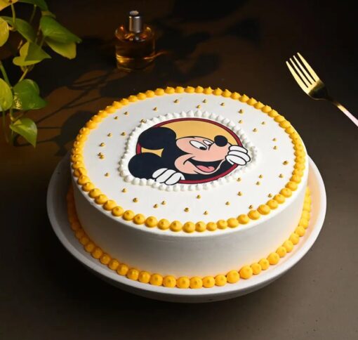 Mickey’s Celebration Cake with colorful fondant decorations, ideal for kids' birthday parties