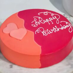 Blush & Citrus Velvet Cake with pink and orange layers and creamy frosting