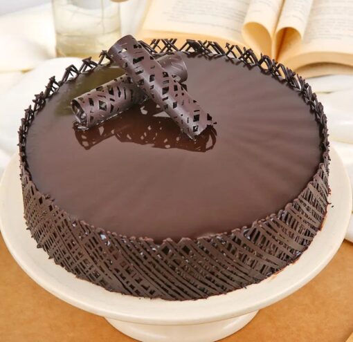 Truffle Temptation Cake with rich chocolate glaze and creamy truffle layers – perfect for birthdays, parties, and chocolate lovers.
