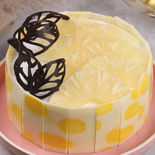 Golden Pineapple Delight Cake with moist layers and fresh pineapple topping.