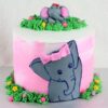 Elephant Safari Chocolate Cake with elephant toppers and jungle-themed decorations.