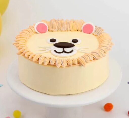 Jungle King Cake with lion and jungle-themed decorations.