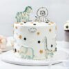 Jungle Animal Party Cake with colorful fondant animal decorations and jungle theme.