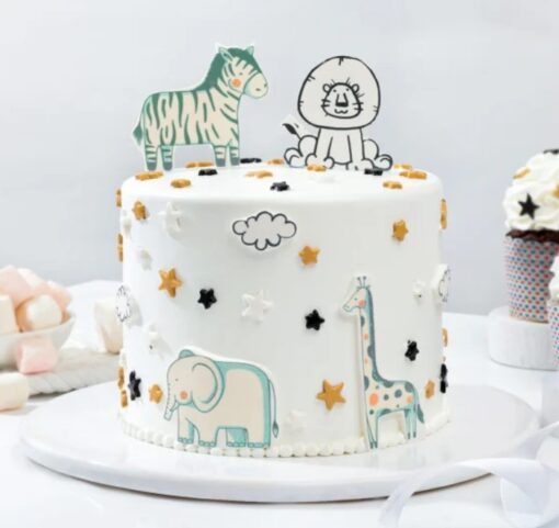 Jungle Animal Party Cake with colorful fondant animal decorations and jungle theme.