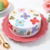 Floral Pearl Dream Cake with intricate floral designs and pearl decorations.