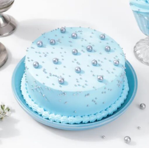 Blue Pearl Delight Cake with smooth blue frosting and pearl decorations.