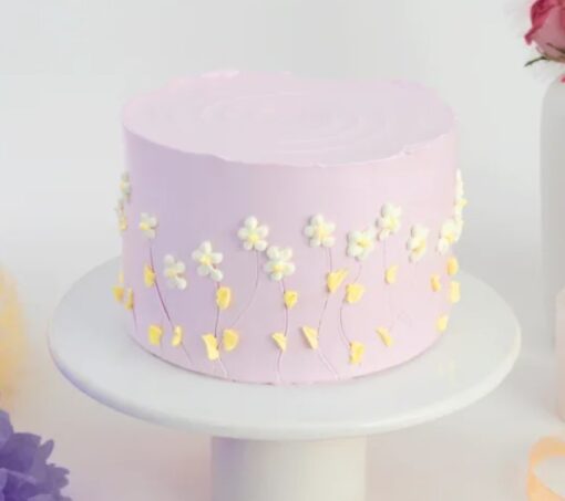 Pink Garden Delight Cake with delicate pink frosting and floral decorations.