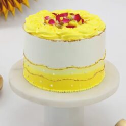 Rasmalai Fusion Cake with creamy frosting, pistachio garnish, and rasmalai pieces.