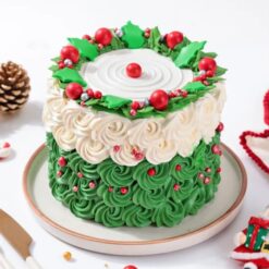 Festive Christmas Wreath Cake decorated with red and green frosting and holiday ornaments.