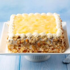 Fresh Cream Pineapple Cake with juicy pineapple pieces and smooth cream frosting.