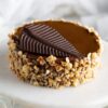 Hazelnut Praline Mousse Cake with creamy mousse layers and crunchy praline topping.