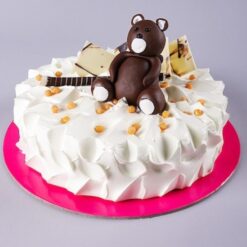 Butterscotch Teddy Bear Cake decorated with cute teddy bear toppers and creamy butterscotch frosting.