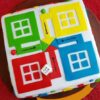 Colorful Ludo Cake decorated with bright fondant colors and game tokens, perfect for birthday celebrations.