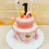 Pink First Birthday Cake decorated with cute pink frosting and birthday decorations, perfect for a baby’s first birthday celebration.