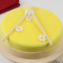 Pineapple Garden Delight Cake topped with tropical fruit and floral decor