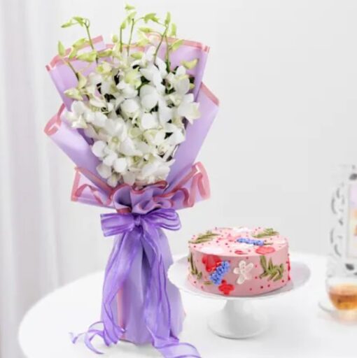 Elegant blushing orchids bouquet with delicious cake perfect for birthdays anniversaries and special celebrations