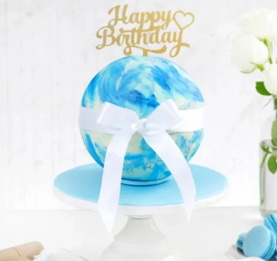 Sky Pinata Ball Cake with Hidden Candy Surprise Sky Pinata Ball Cake – blue spherical cake with hidden candy surprise inside