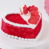 Heart-shaped Sweetheart Velvet Cake with red velvet layers and cream cheese frosting, decorated with romantic details.